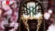 Vessel de Sleep Token masqué parmi des fleurs pour Take Me Back To Eden